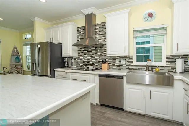 a kitchen with a sink stove and refrigerator