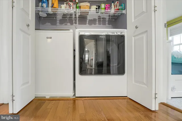 a spacious bathroom with a sink a mirror and a toilet