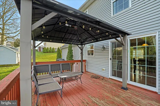 a view of a chair and table in the balcony