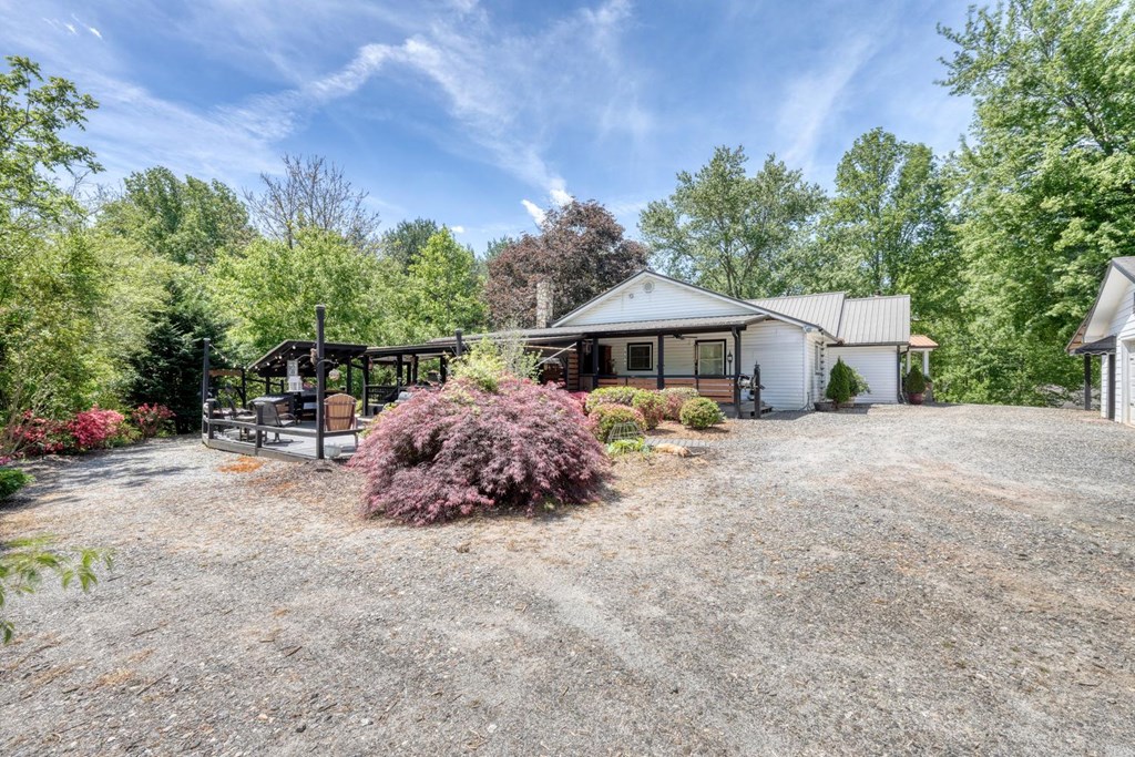 710 Town Mountain Road Hayesville, NC 28904 - Photo 2 of 68 a view of a house with backyard and sitting area