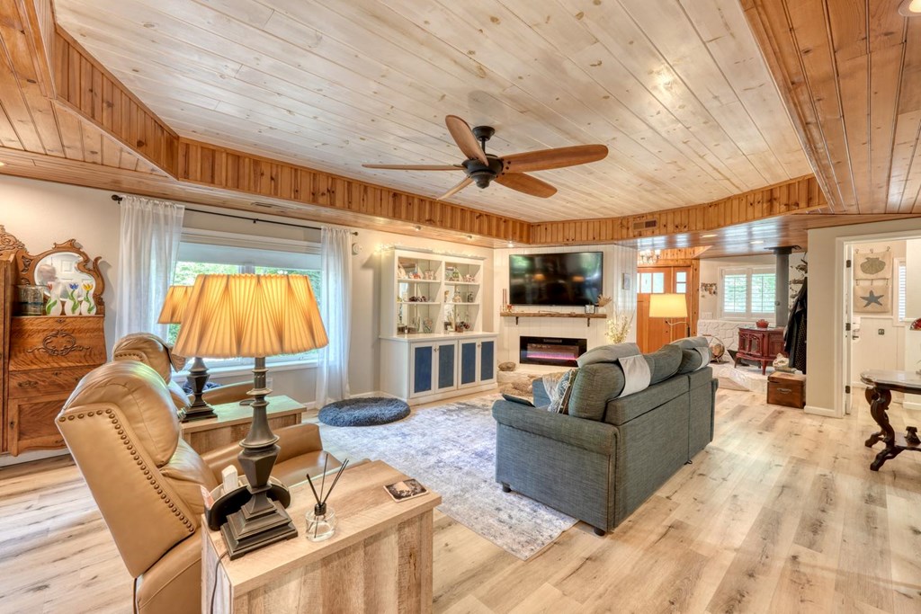 710 Town Mountain Road Hayesville, NC 28904 - Photo 25 of 68 a living room with fireplace furniture and a large window