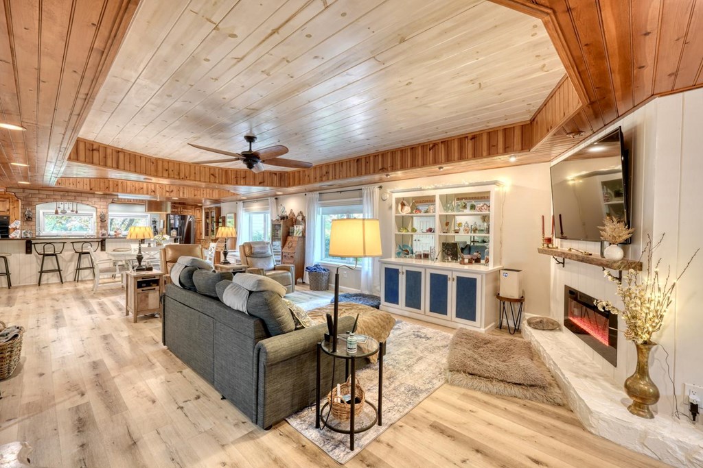 710 Town Mountain Road Hayesville, NC 28904 - Photo 27 of 68 a living room with furniture and a flat screen tv