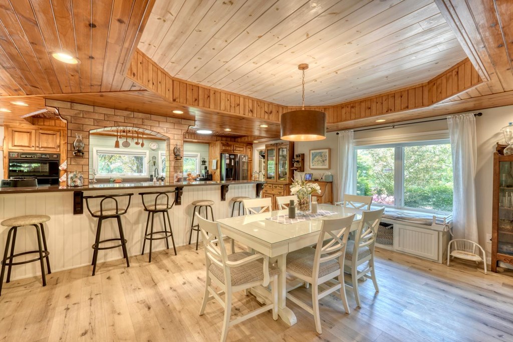 710 Town Mountain Road Hayesville, NC 28904 - Photo 30 of 68 a view of a dining room with furniture window and outside view