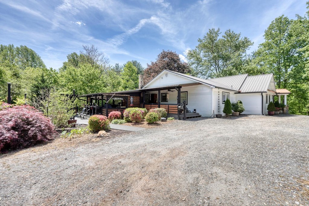 710 Town Mountain Road Hayesville, NC 28904 - Photo 3 of 68 a view of a house with backyard and furniture