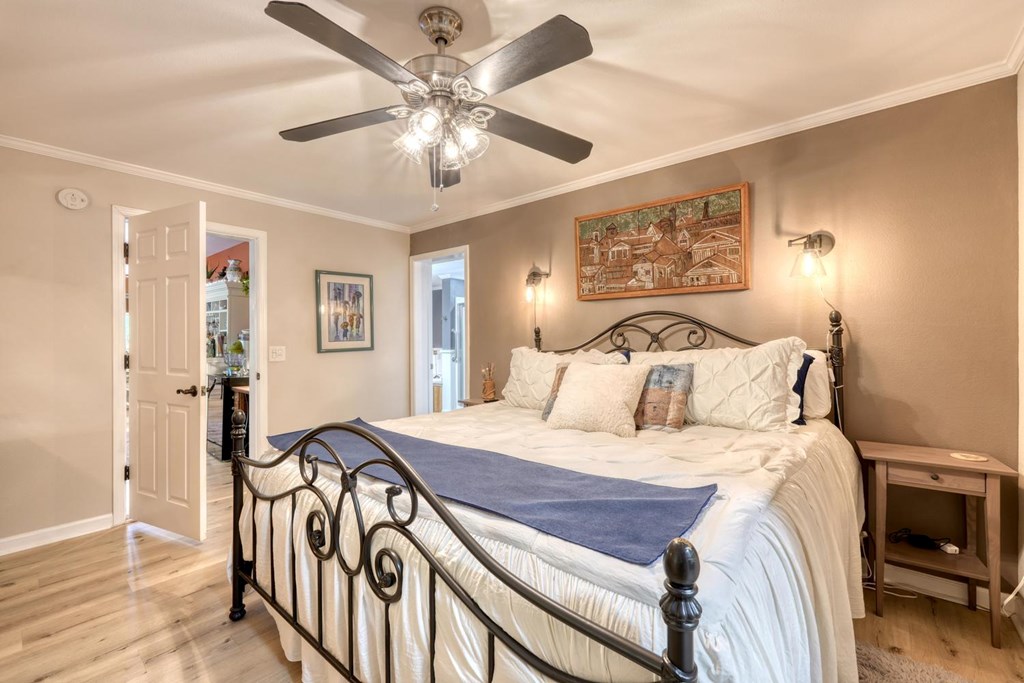 710 Town Mountain Road Hayesville, NC 28904 - Photo 42 of 68 a bedroom with a bed and a chandelier