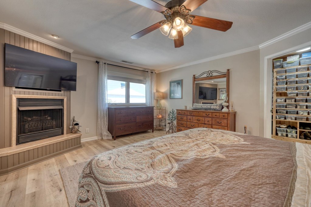 710 Town Mountain Road Hayesville, NC 28904 - Photo 43 of 68 a large bedroom with a bed and a television on the dresser