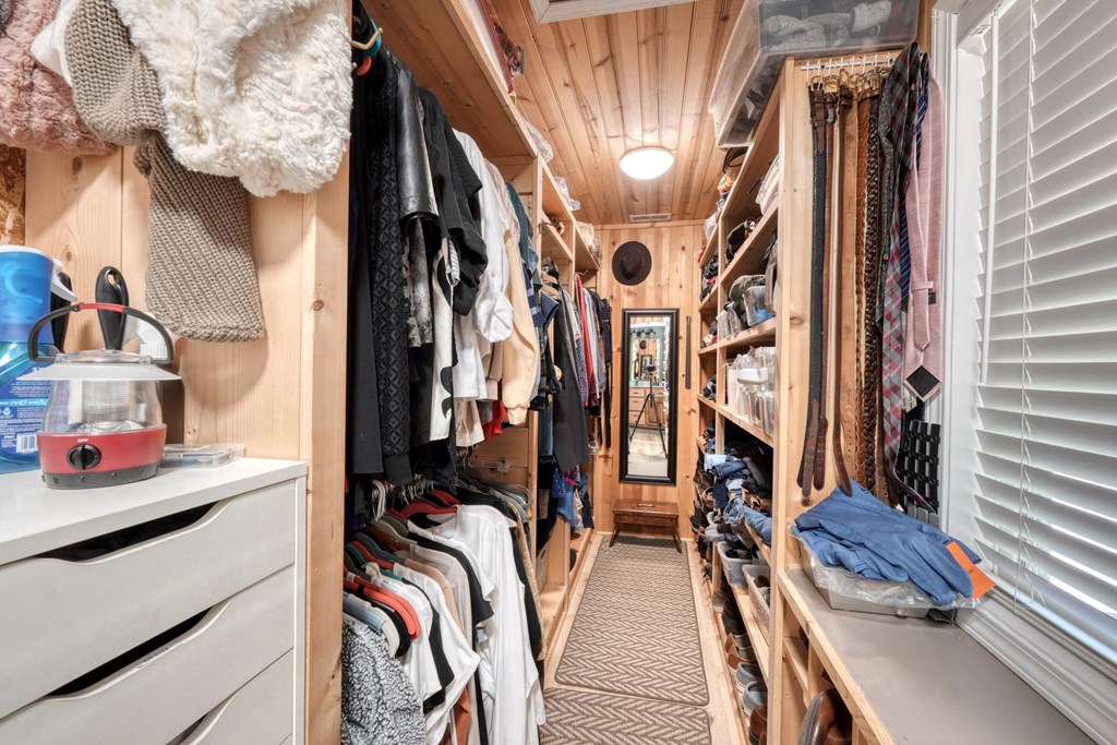 710 Town Mountain Road Hayesville, NC 28904 - Photo 46 of 68 a view of walk in closet with clothes and shoes