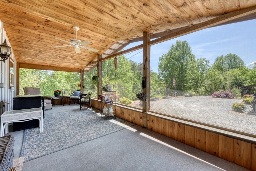 710 Town Mountain Road Hayesville, NC 28904 - Photo 52 of 68 a living room with furniture and a large window