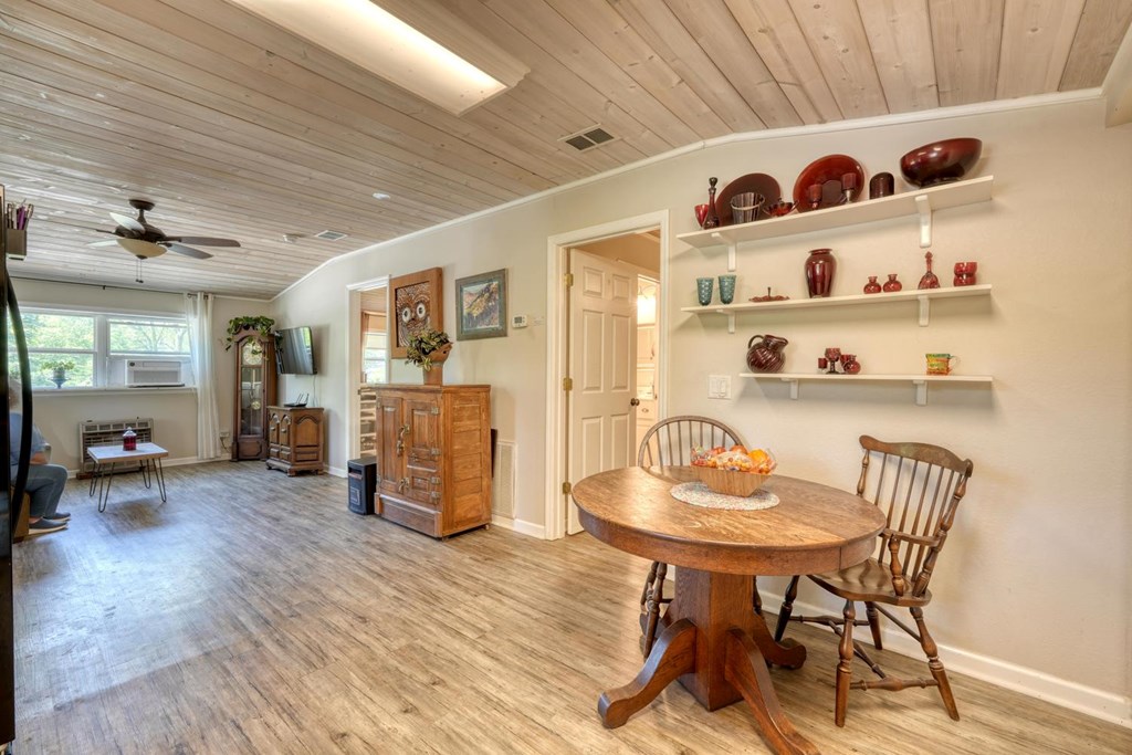 710 Town Mountain Road Hayesville, NC 28904 - Photo 56 of 68 a view of a dining room with furniture and wooden floor