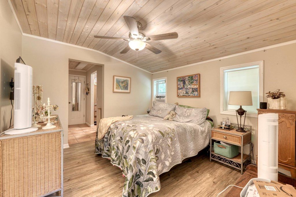 710 Town Mountain Road Hayesville, NC 28904 - Photo 57 of 68 a bedroom with a bed and a chandelier