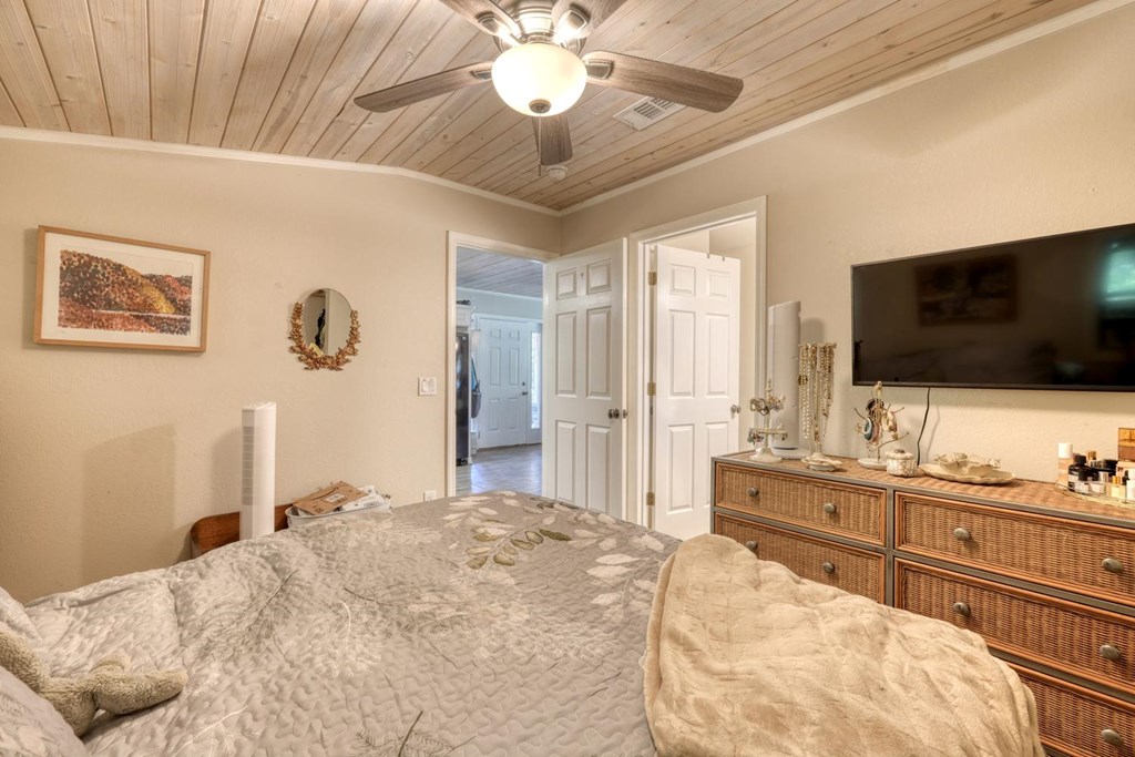 710 Town Mountain Road Hayesville, NC 28904 - Photo 60 of 68 a bedroom with a bed and a flat screen tv