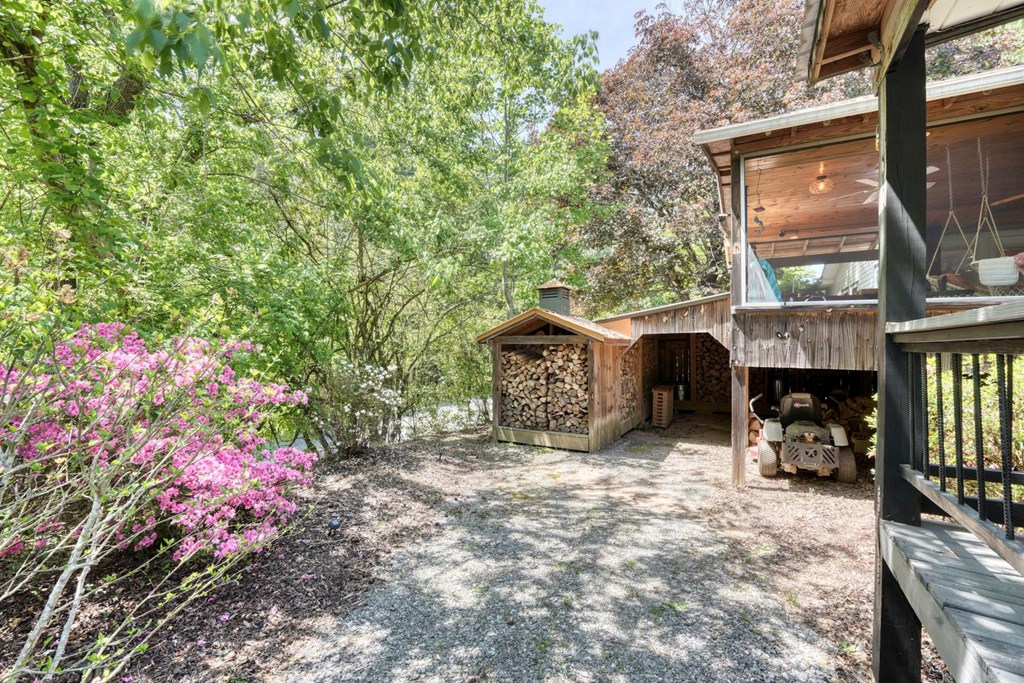 710 Town Mountain Road Hayesville, NC 28904 - Photo 6 of 68 a view of a chairs and table in the patio next to a yard