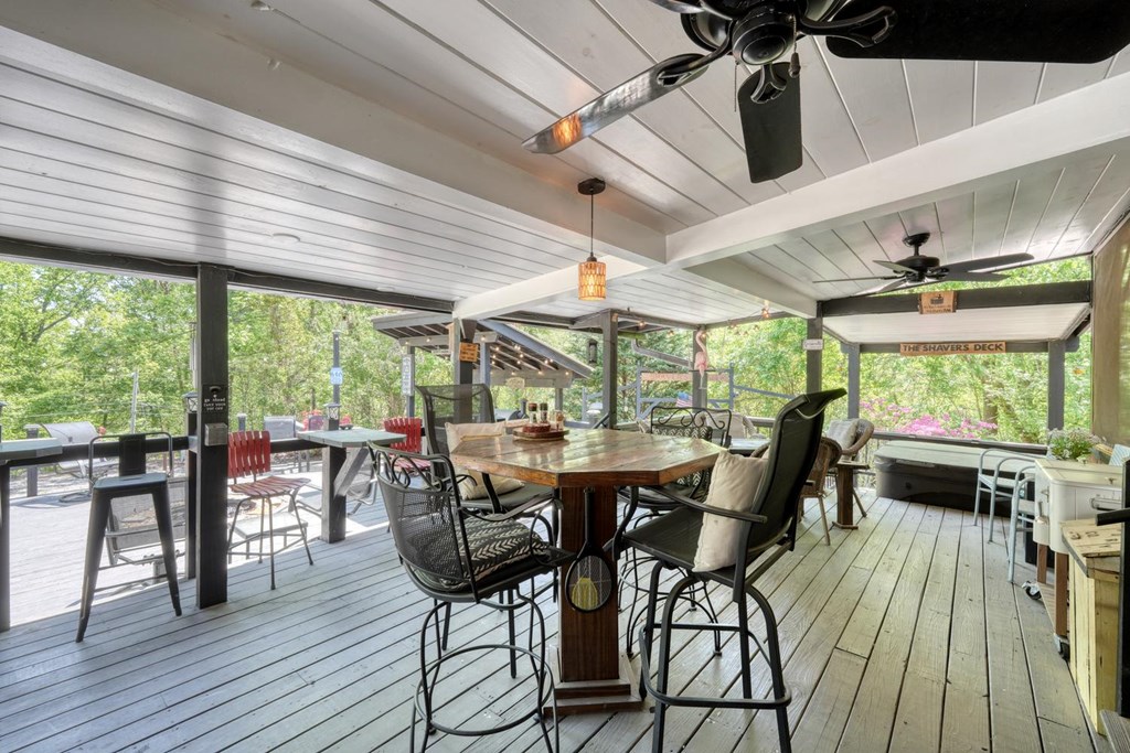 710 Town Mountain Road Hayesville, NC 28904 - Photo 9 of 68 a view of a dining room with furniture large windows and wooden floor