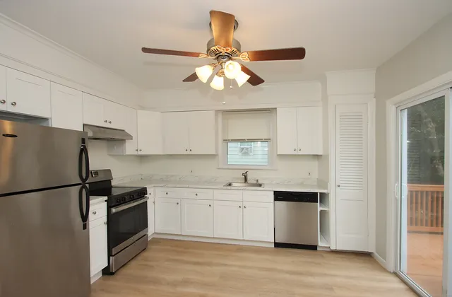 a kitchen with a refrigerator a sink and dishwasher