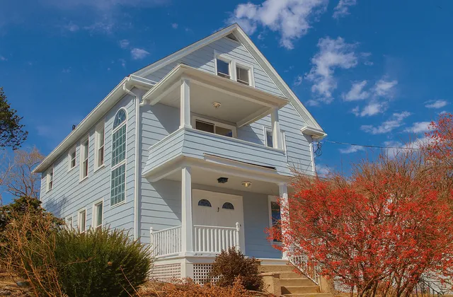 a view of a house with a small yard