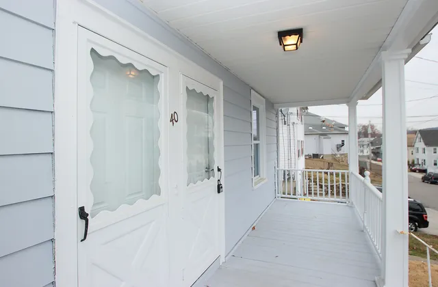 a view of a bathroom with a tub shower and windows