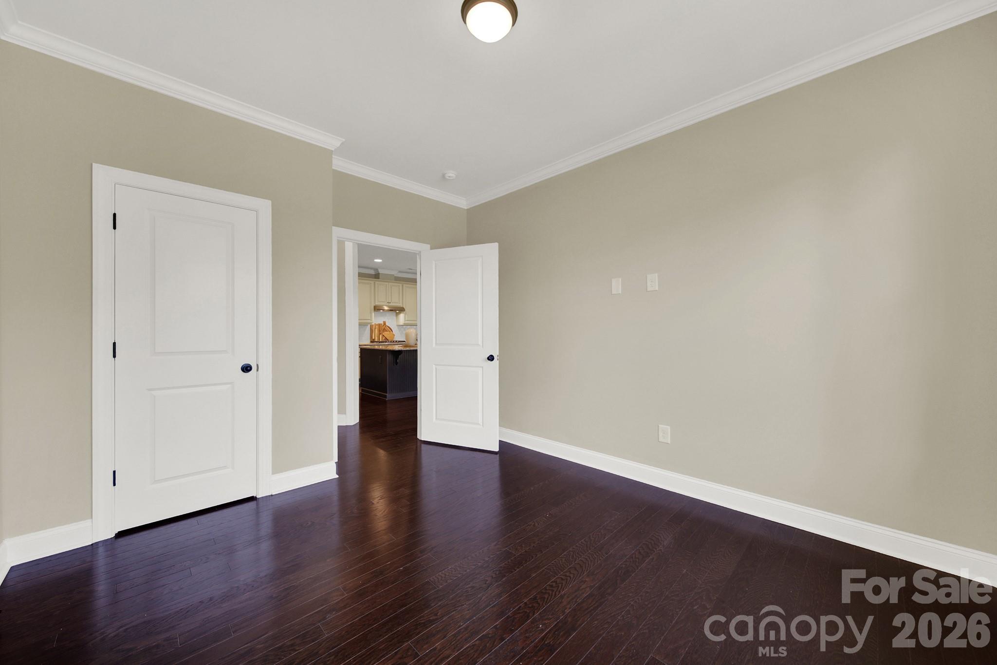 989 Emory Lane Fort Mill, SC 29708 - Photo 17 of 48 a view of an empty room with wooden floor and windows