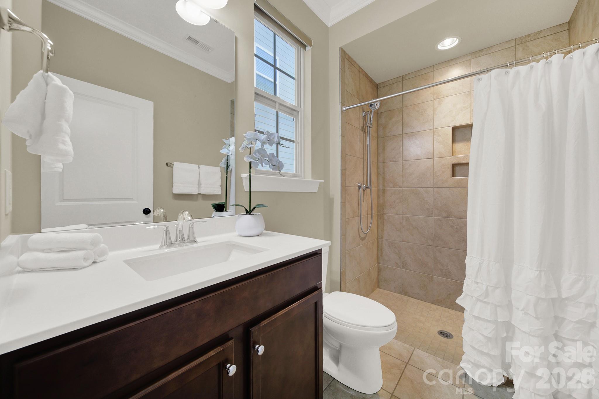 989 Emory Lane Fort Mill, SC 29708 - Photo 18 of 48 a bathroom with a granite countertop sink toilet and shower