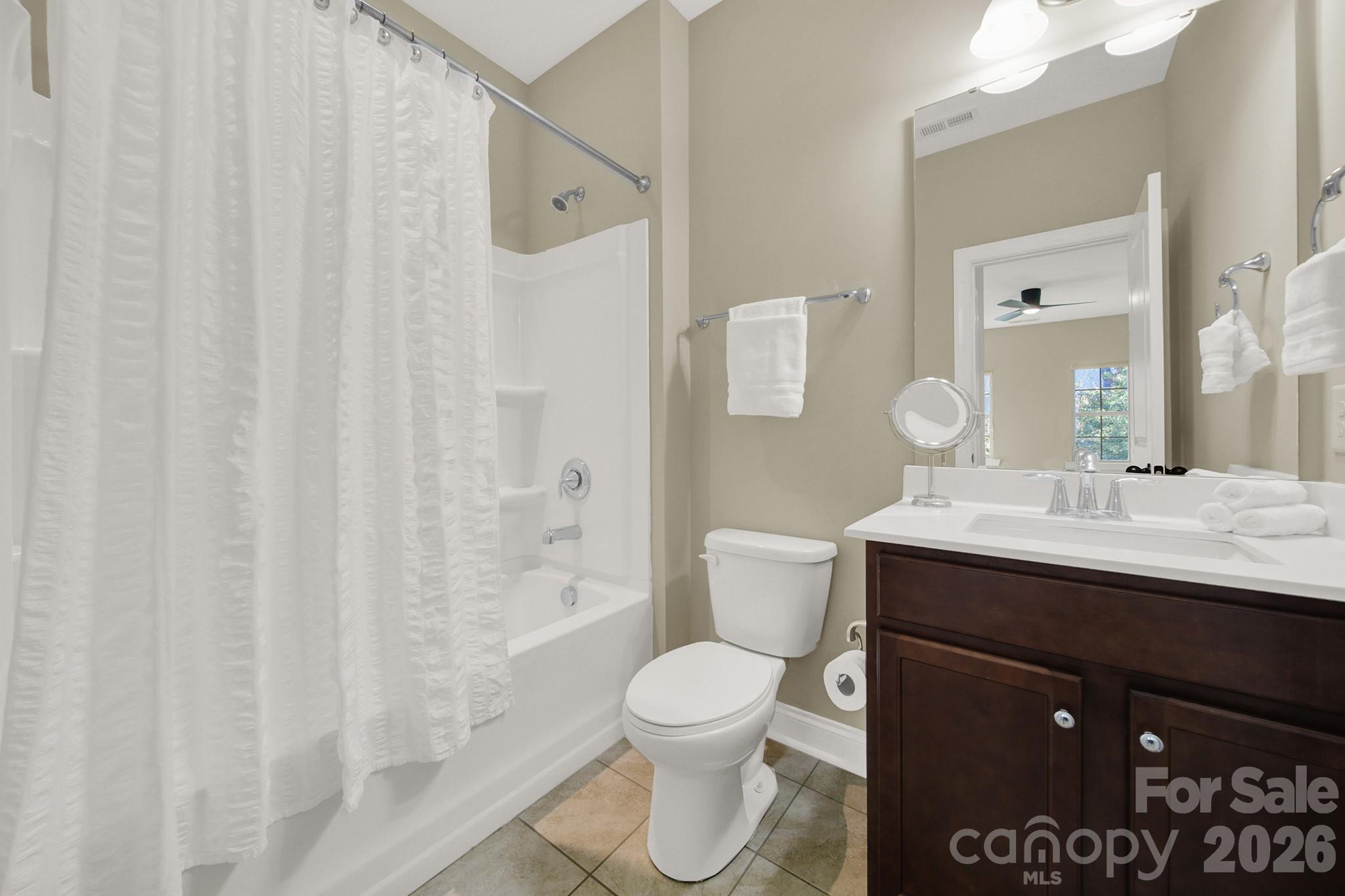 989 Emory Lane Fort Mill, SC 29708 - Photo 28 of 48 a bathroom with a sink a toilet and shower curtain