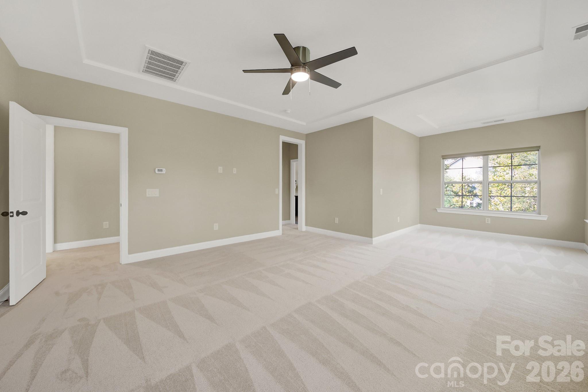 989 Emory Lane Fort Mill, SC 29708 - Photo 35 of 48 a view of a livingroom with a ceiling fan & windows