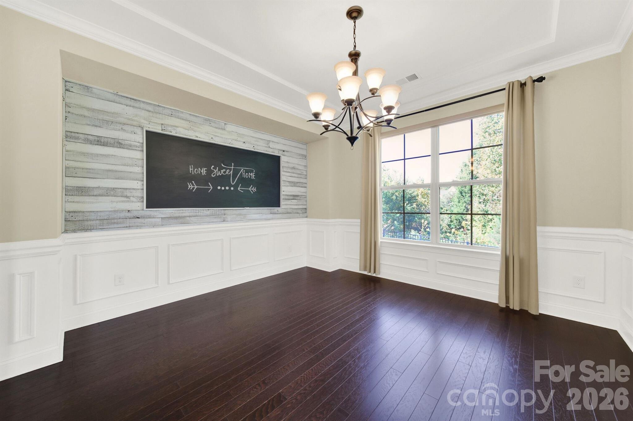 989 Emory Lane Fort Mill, SC 29708 - Photo 7 of 48 a view of an empty room with wooden floor and a window