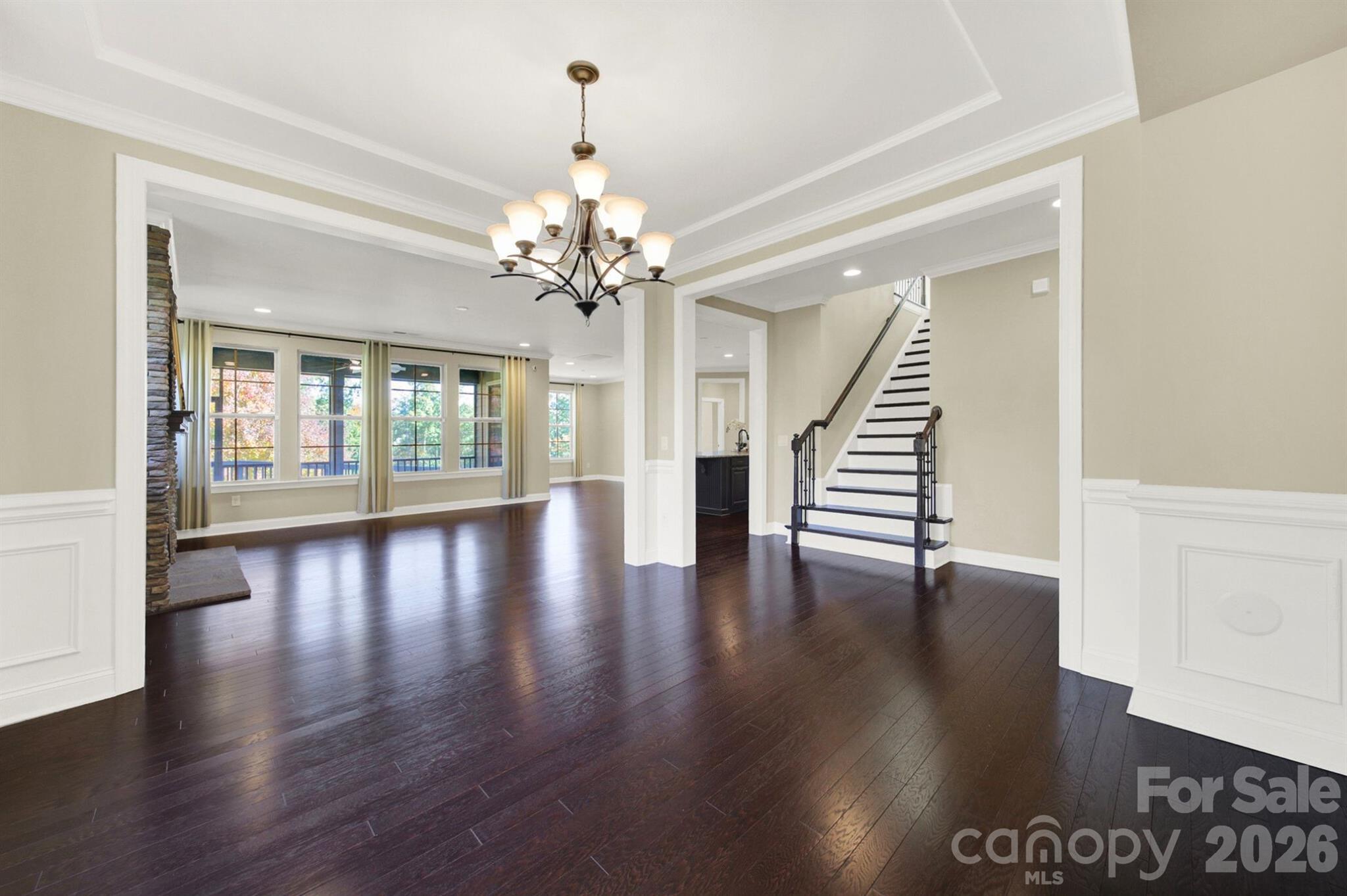 989 Emory Lane Fort Mill, SC 29708 - Photo 8 of 48 an empty room with wooden floor and large windows
