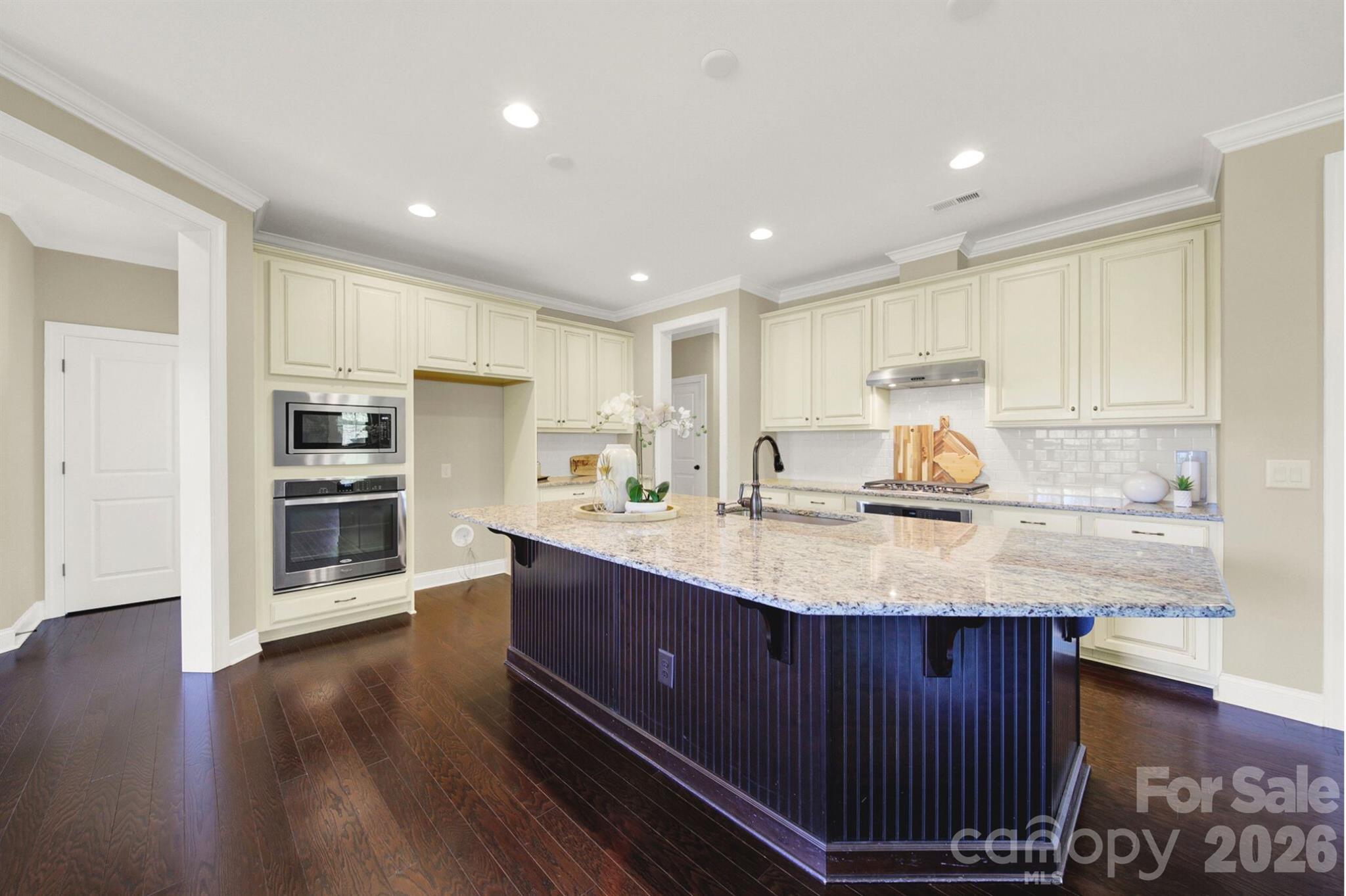989 Emory Lane Fort Mill, SC 29708 - Photo 9 of 48 a kitchen with stainless steel appliances granite countertop a sink counter space and cabinets