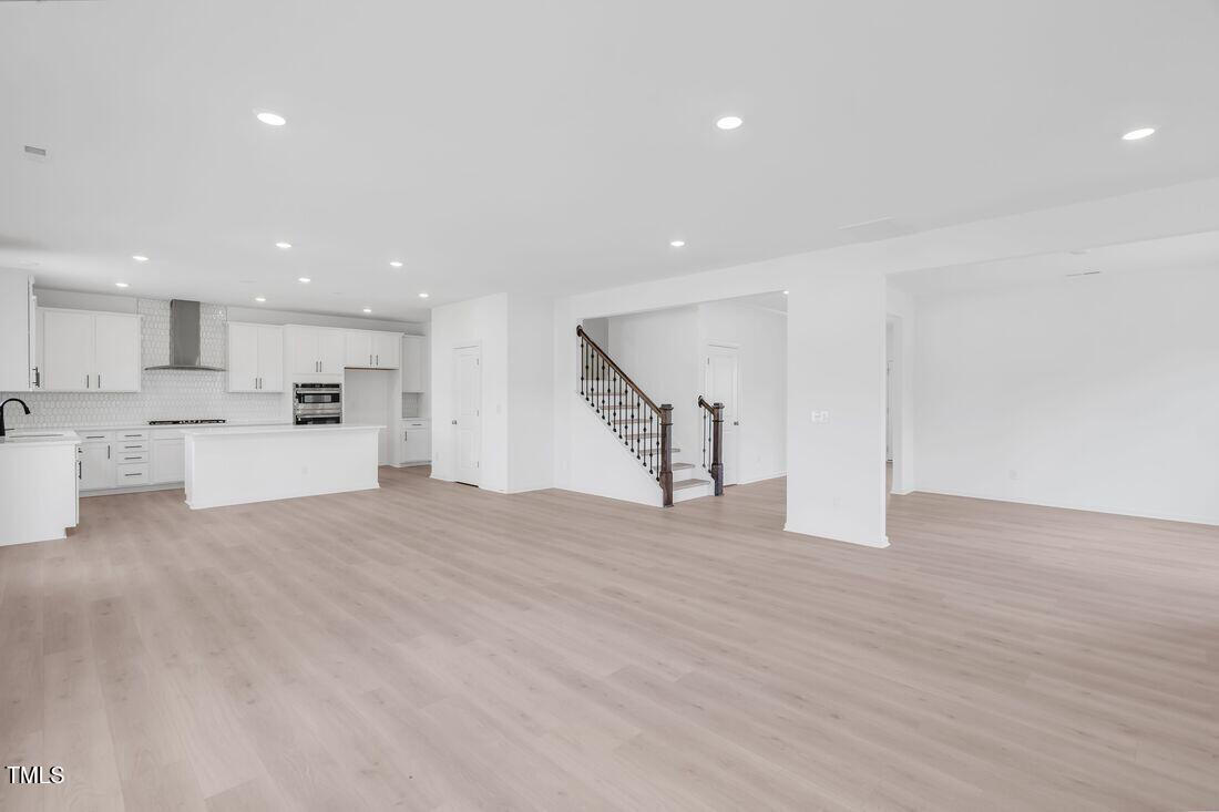 921 Kinglet House Road Knightdale, NC 27545 - Photo 3 of 33 silverstone-bedford-tv-lounge-to-kitchen