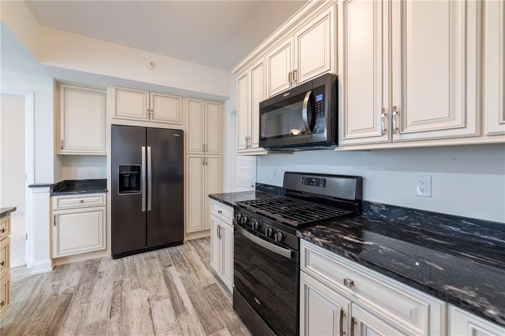 234 Adams Pointe Boulevard, Unit 2 Mars, PA 16046 - Photo 14 of 36 a kitchen with a refrigerator stove and microwave