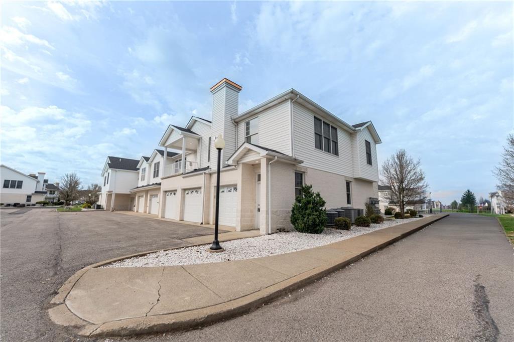234 Adams Pointe Boulevard, Unit 2 Mars, PA 16046 - Photo 2 of 36 a front view of a house with a garden