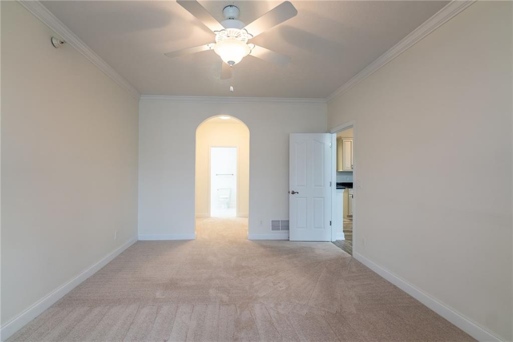 234 Adams Pointe Boulevard, Unit 2 Mars, PA 16046 - Photo 21 of 36 an empty room with a empty space and a ceiling fan