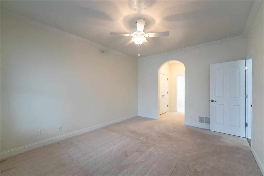 234 Adams Pointe Boulevard, Unit 2 Mars, PA 16046 - Photo 22 of 36 an empty room with chandelier fan and windows