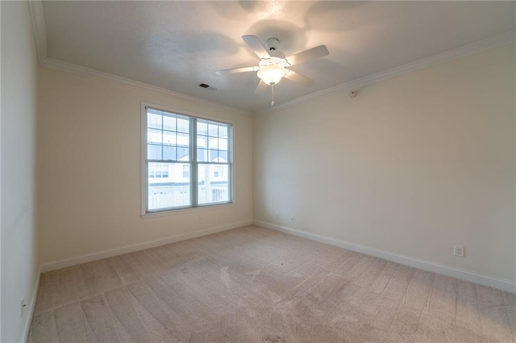 234 Adams Pointe Boulevard, Unit 2 Mars, PA 16046 - Photo 25 of 36 an empty room with a chandelier fan and window