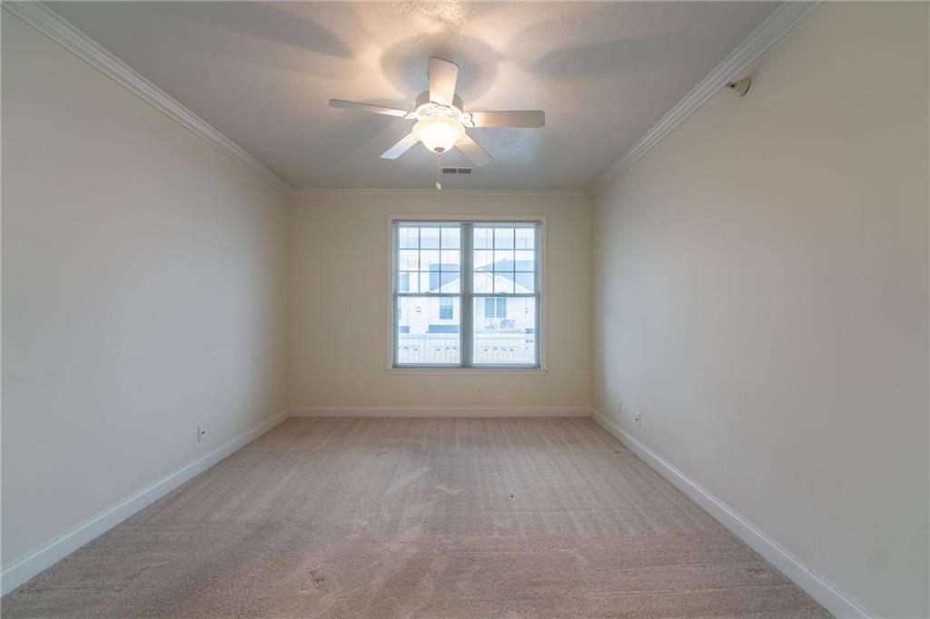 234 Adams Pointe Boulevard, Unit 2 Mars, PA 16046 - Photo 26 of 36 an empty room with a chandelier fan and windows