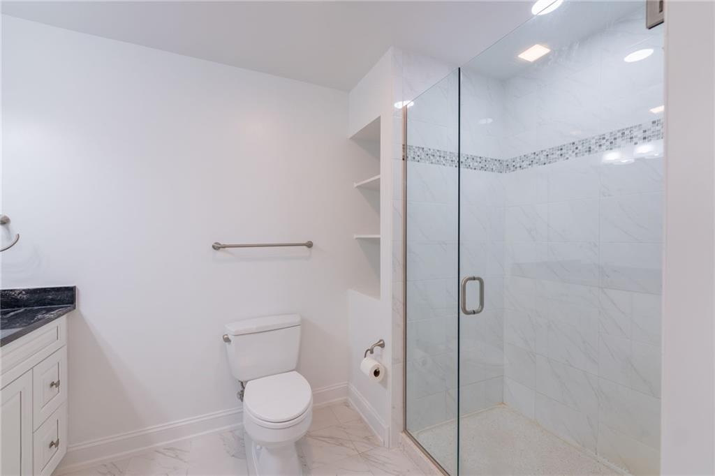 234 Adams Pointe Boulevard, Unit 2 Mars, PA 16046 - Photo 28 of 36 a bathroom with a shower a toilet and sink