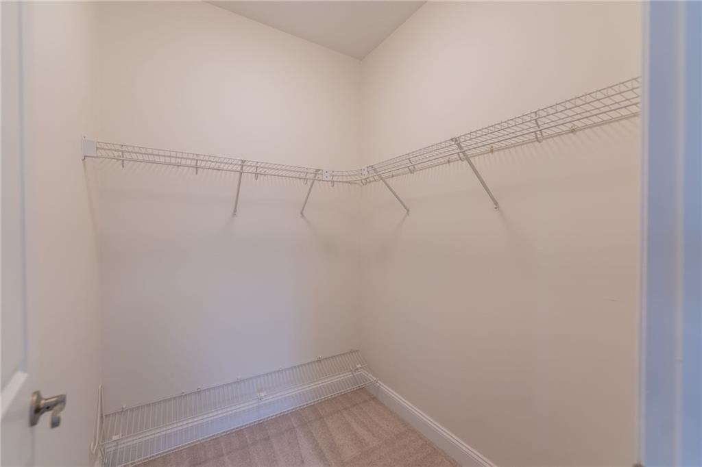 234 Adams Pointe Boulevard, Unit 2 Mars, PA 16046 - Photo 34 of 36 a view of a room with racks on the wall