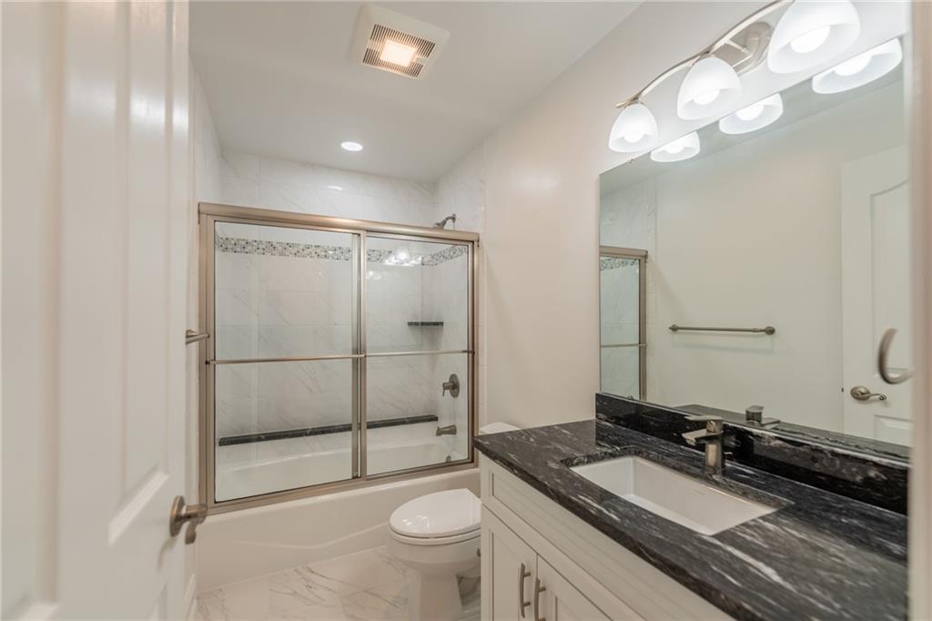 234 Adams Pointe Boulevard, Unit 2 Mars, PA 16046 - Photo 36 of 36 a bathroom with a granite countertop sink mirror vanity and toilet