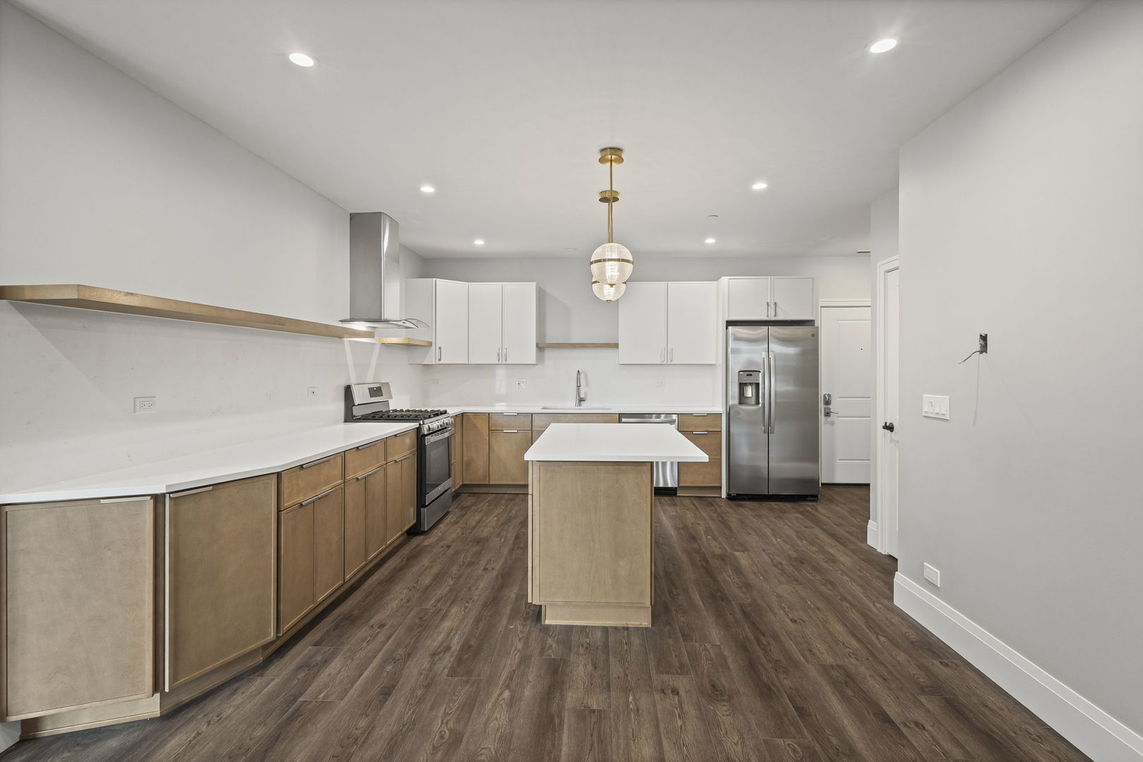 1036 Lake Street, Unit 4S Oak Park, IL 60301 - Photo 11 of 29 a large kitchen with a center island stainless steel appliances and cabinets
