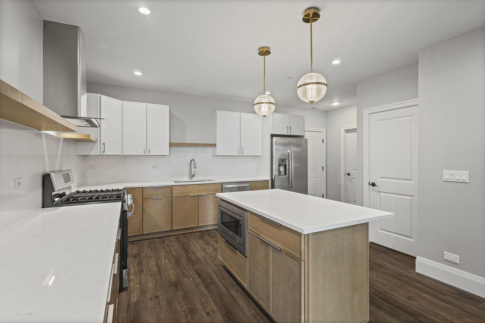 1036 Lake Street, Unit 4S Oak Park, IL 60301 - Photo 13 of 29 a kitchen with a refrigerator a sink and cabinets