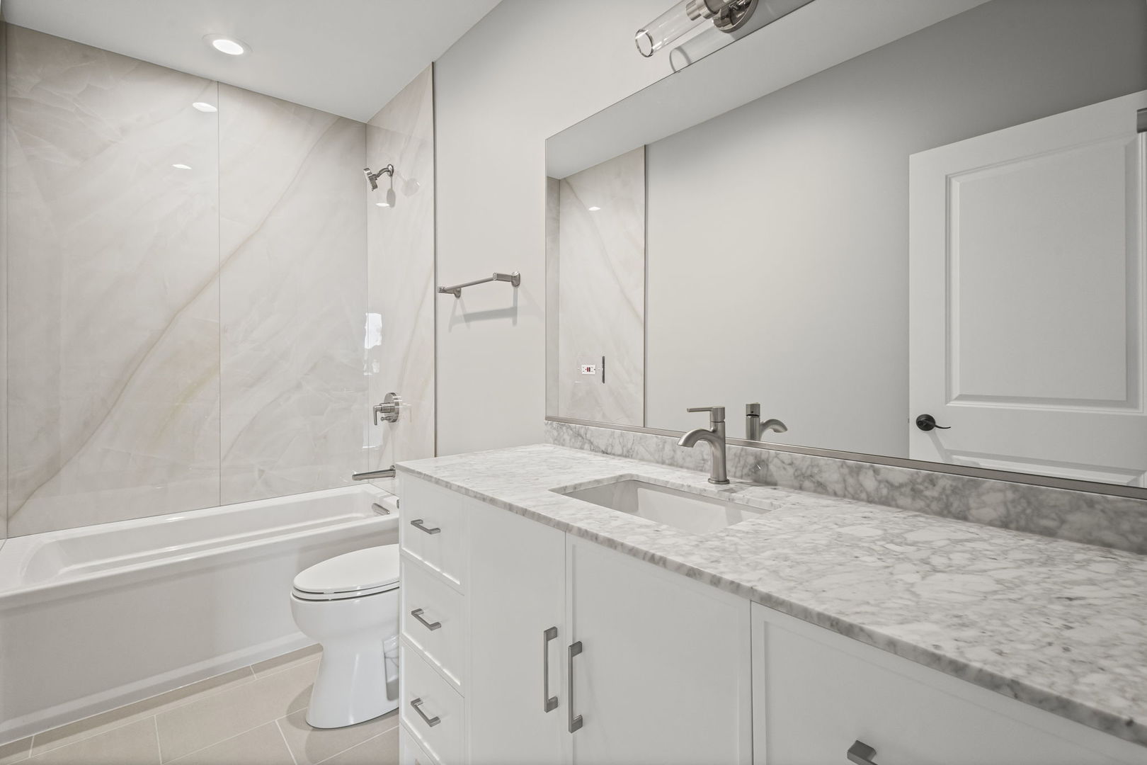 1036 Lake Street, Unit 4S Oak Park, IL 60301 - Photo 25 of 29 a bathroom with a granite countertop sink toilet and shower