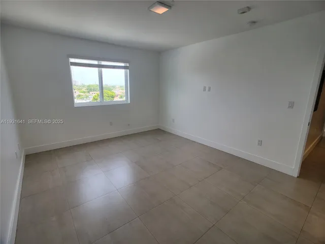a bathroom with a granite countertop sink toilet a mirror and shower