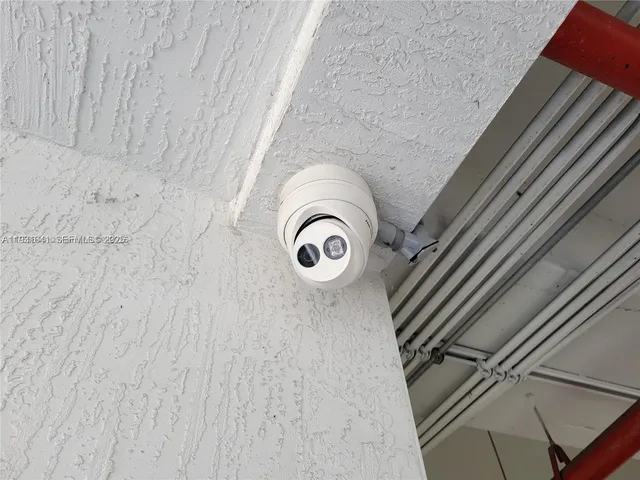 an empty room with a kitchen and a window