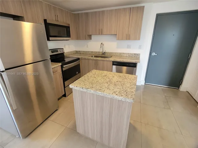 a view of a kitchen with a sink