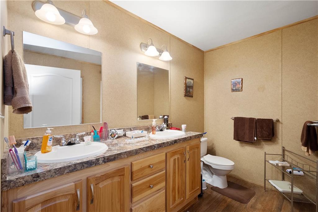 534 Finks Run Road McDonald, PA 15057 - Photo 24 of 35 a bathroom with a granite countertop sink mirror and toilet