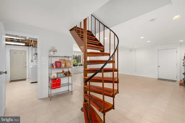 a view of entryway with stairs and toys