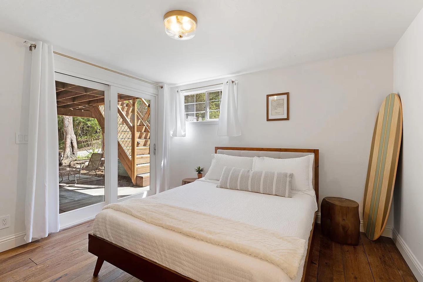 1003 Laurel Glen Road Soquel, CA 95073 - Photo 46 of 101 a bedroom with a bed and a large window