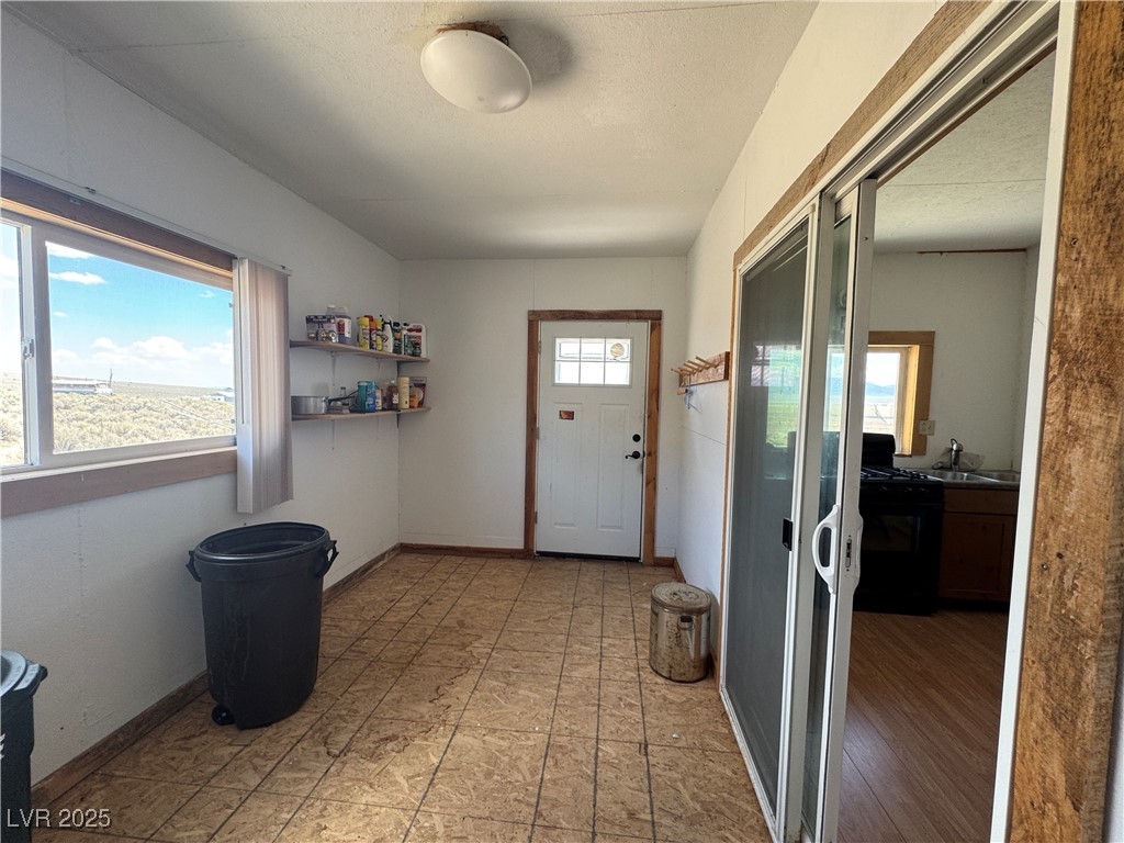 25 North Main Street Ely, NV 89301 - Photo 29 of 38 Entryway featuring baseboards and a textured ceiling
