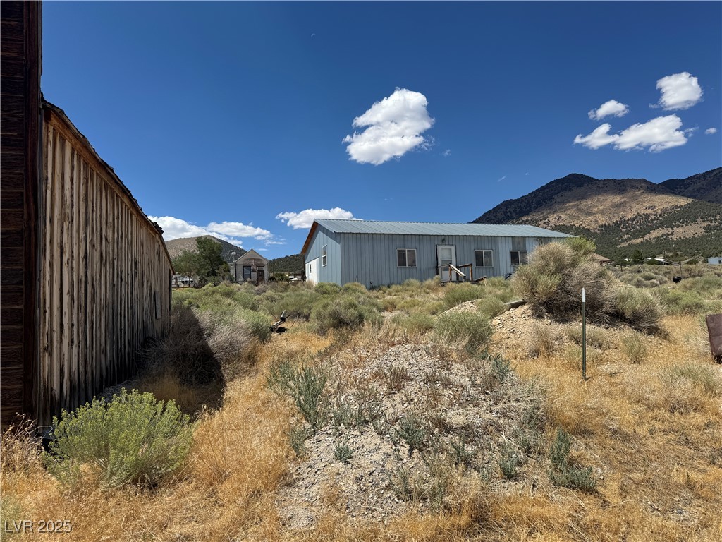 25 North Main Street Ely, NV 89301 - Photo 8 of 38 Back of property featuring a mountain view and an outbuilding