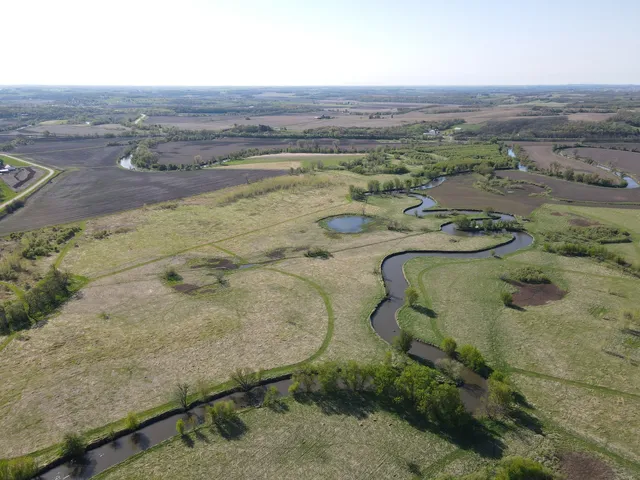 an aerial view of a houses with a yard