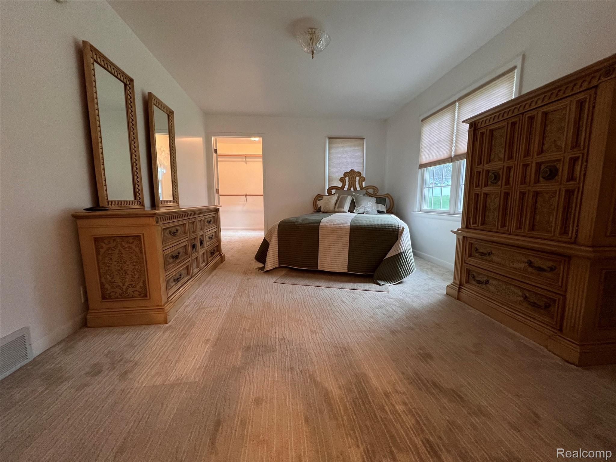 8299 Ridge Road Goodrich, MI 48438 - Photo 16 of 22 Primary bedroom with a walk in closet